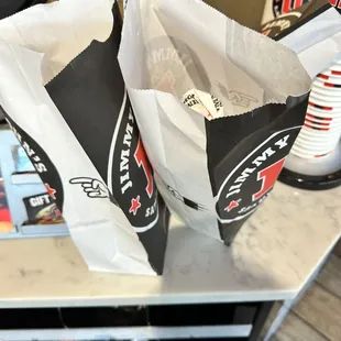 two bags of food on a table