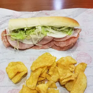 a sub sandwich and chips