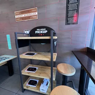 Pick up rack to the right as you walk in