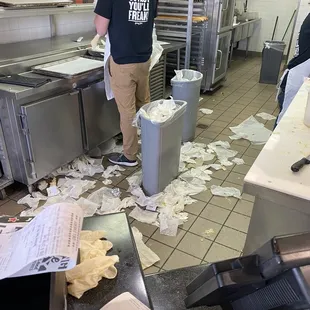 a man standing in a restaurant kitchen