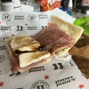 a sandwich with meat and cheese