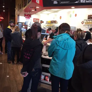 people standing in line at the counter