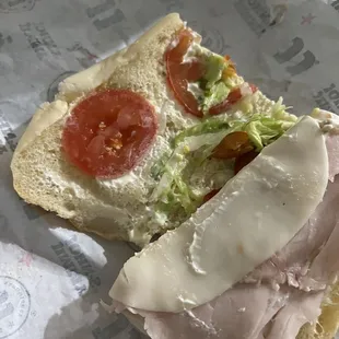a sandwich with meat and cheese