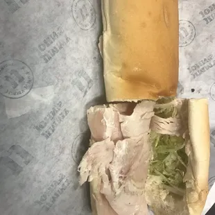 a turkey sandwich with lettuce