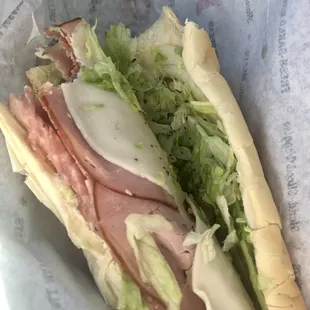 a sandwich with meat and lettuce