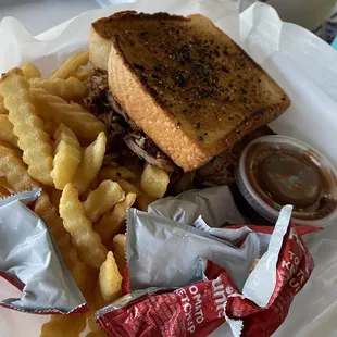 Pulled pork sandwich with fries