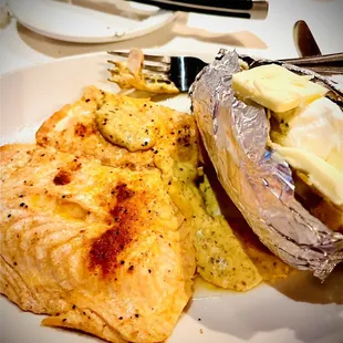 Simply Grilled Salmon with baked potato - picture doesn&apos;t do it Justice! Great server with great concierge! Another great meal!