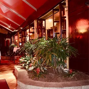 Inside entry patio that has dining.