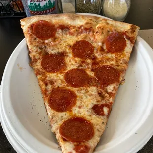 Slice of pepperoni pizza.