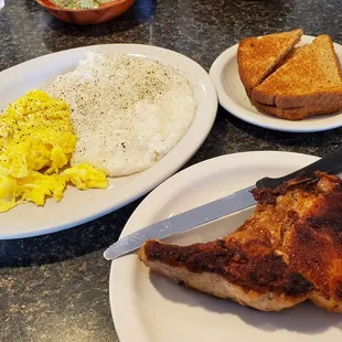 Pork Chop Bone In, Eggs, and gritts with toast