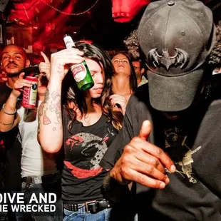 a woman drinking a beer