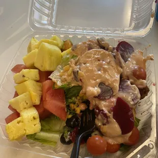 a salad in a plastic container
