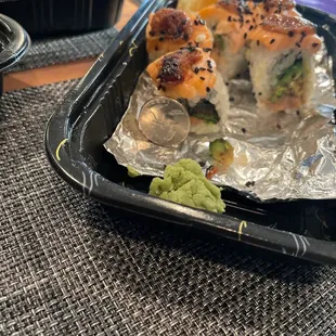 $19 Miso Spicy roll. No spicy tuna inside. Cooked salmon on top which is dry and horrible