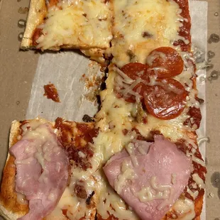 a slice of pizza in a box