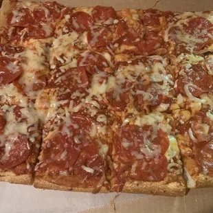 Twelve of the 18 large cut pepperoni pizza