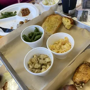 Garlic bread, cornbread, green beans, mac &amp; cheese, potatoes, and garlic butter,