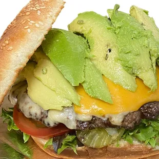 a cheeseburger with avocado