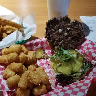 Burger combo with tots and onion rings and a drink. $13.97 for the combo. Bill total was $19.44