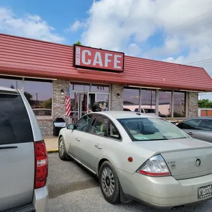 cars parked in front of the restaurant