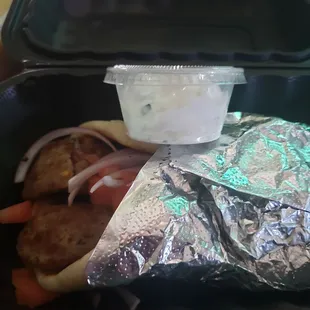 Gyro pita. Not much tzatziki and meat is very thick, not thinly sliced. The pita is warm though, which is nice. It's ok.