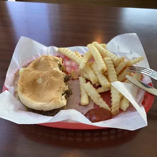 Cheeseburger with crinkle cut fries.