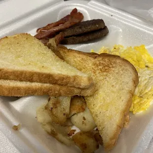 home fries, eggs, bacon, sausage and toast