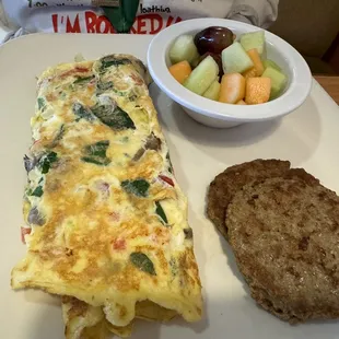an omelet with a side of fruit