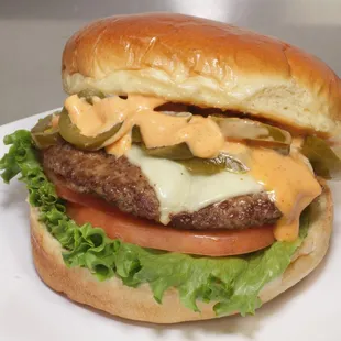 Burger with Cheese and jalapenos added.  They will customize for you.