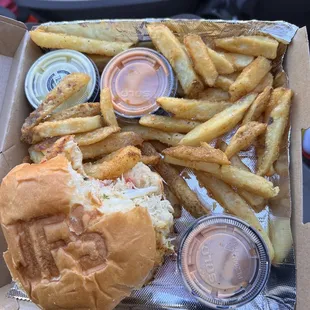 Crab cake size and fries. I ate half the fries already the sauces come in containers about the size of a 50¢ piece