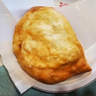 a piece of pizza on a plate