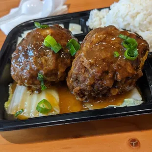 Braised "Lion's Head" Meatball Rice Box with pickled radish,  soy sauce egg, and soup. 10.95 with cash. Good value