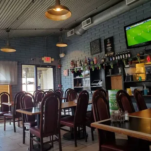 Tin ceiling and brick walls