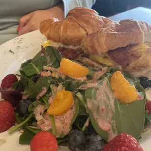 Croissant sandwich with a side salad