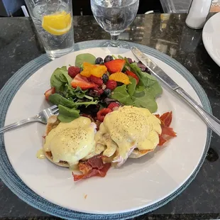 Eggs Benedict with breakfast salad