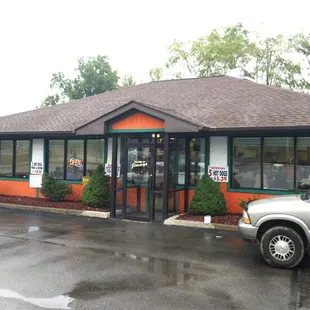 a car parked in front of a restaurant