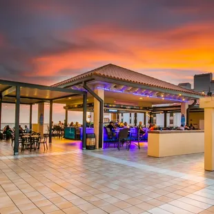 a colorful sunset over a restaurant