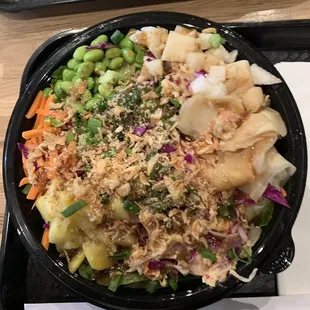 Poke bowl with Spicy Crap, Spicy Yellowtail, Aloha Tuna on a salad.