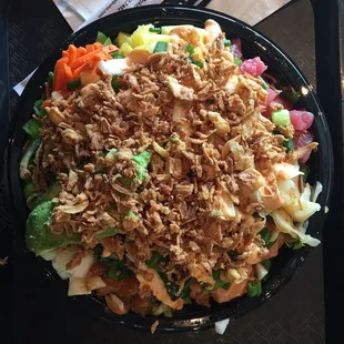 Large poke bowl with so many toppings.
