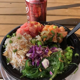 Salmon, tuna, crab poke bowl with white rice and lettuce