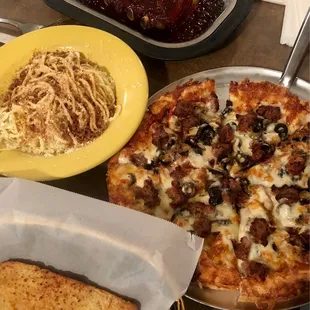 1/2 rack of ribs, spaghetti with brown butter and mizithra, garlic bread and pizza (pep, sausage &amp; olives)