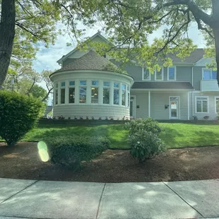 Exterior.  Round section is dining room area. Nice view and lighting lovely.