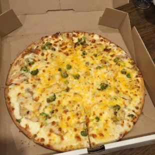 Chicken, broccoli, and white sauce.