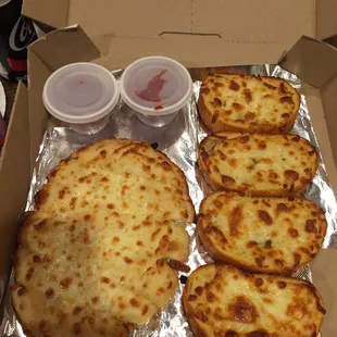 a box of cheese pizzas