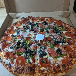 Pepperoni, sausages, and veg pizza