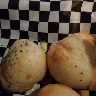 Garlic Knots, drenched in cheesy garlic butter.