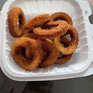 onion rings in a styrofoam container