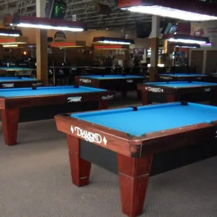 billiard tables in a large room