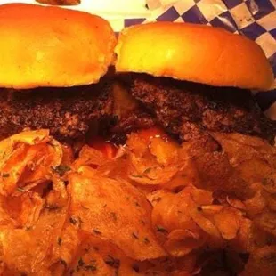 A couple of sliders with a basket of homemade chips