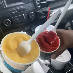 two cups of ice cream and a spoon