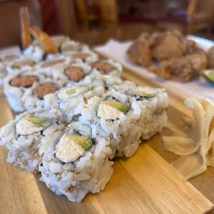 a plate of sushi and a plate of shrimp